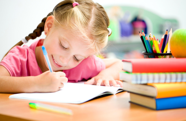 girl learning to write