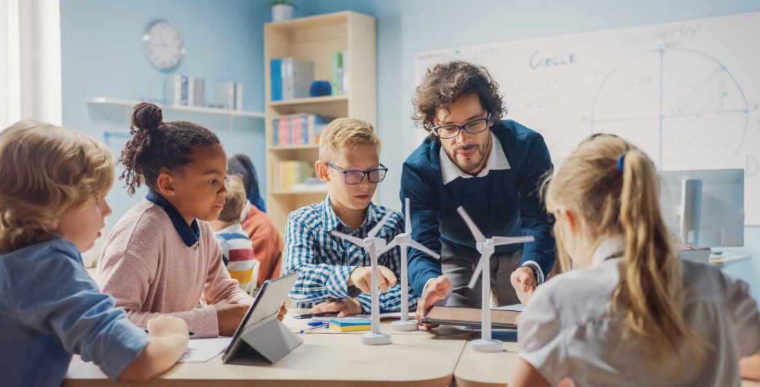 a teacher teaching children with autism in the classroom