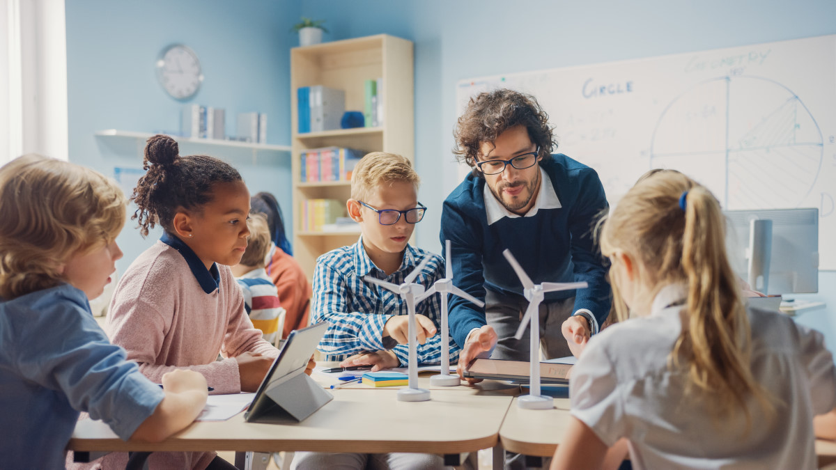 a teacher teaching children with autism in the classroom